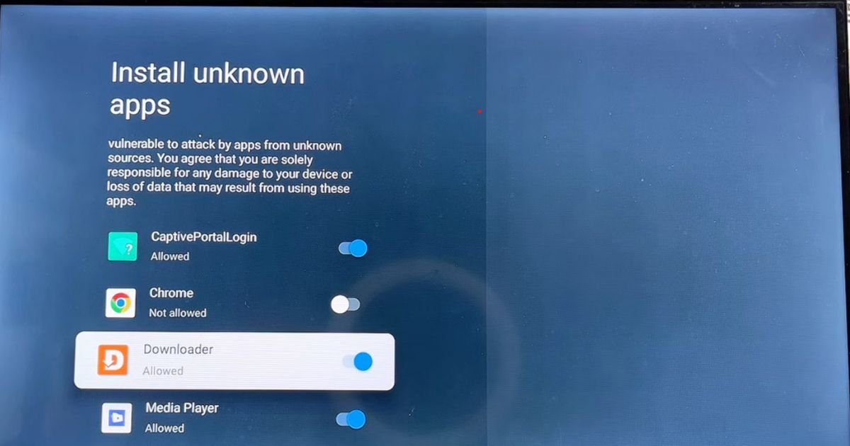 A TCL TV settings screen where the toggle for the Downloader app is switched to ON, specifically allowing it to install IPTV Smarters Pro.
